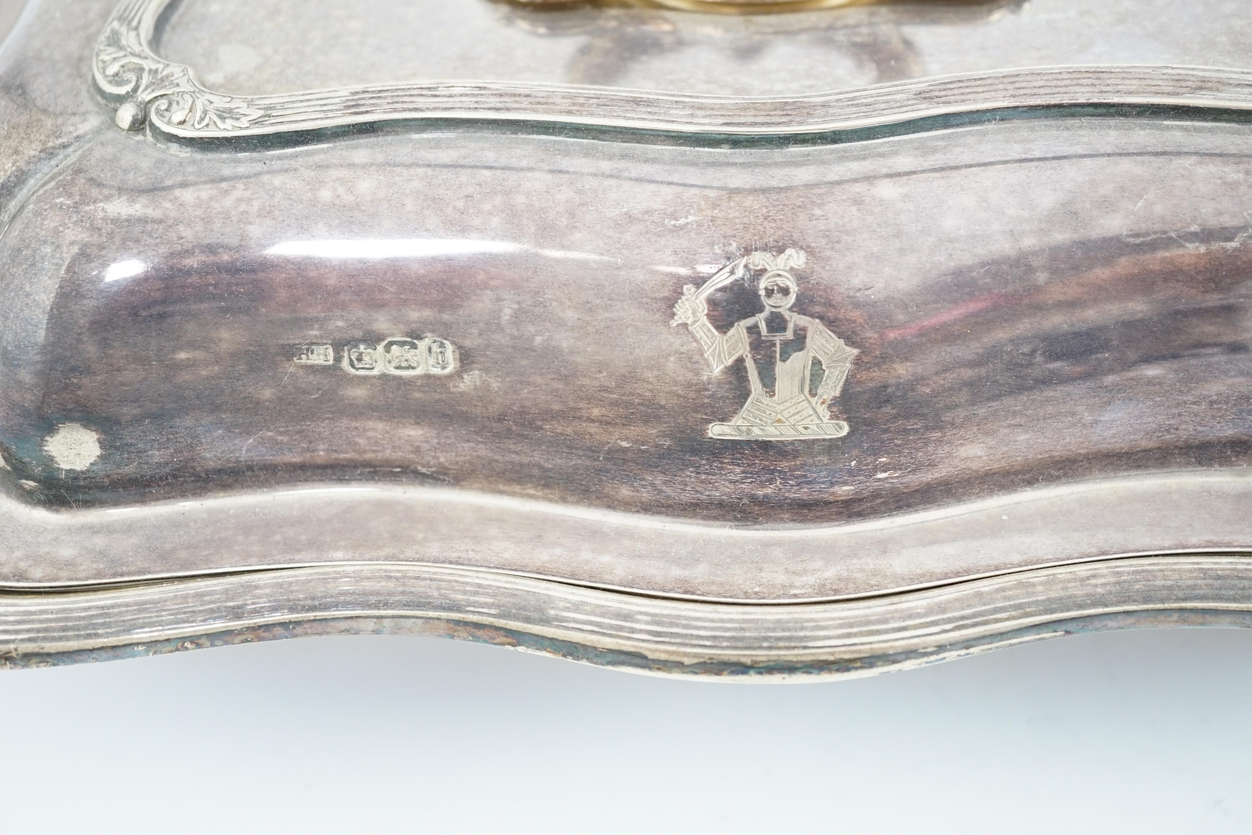 A pair of late Victorian silver entreé dishes and covers, with handles, by Harrison Brothers